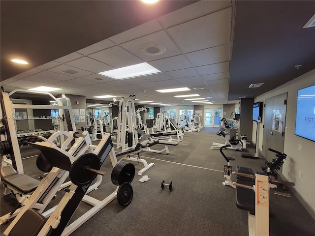 gym featuring a drop ceiling