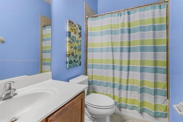 bathroom with vanity, toilet, tile patterned flooring, and a shower with shower curtain