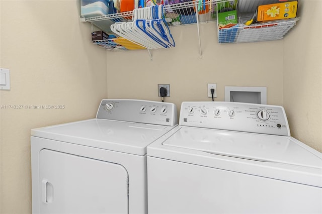 laundry room with separate washer and dryer