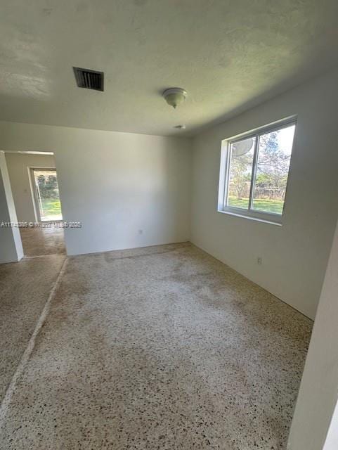 empty room with a textured ceiling