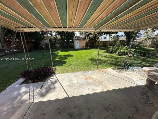 view of patio with a shed