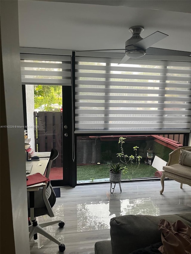 sunroom / solarium with ceiling fan