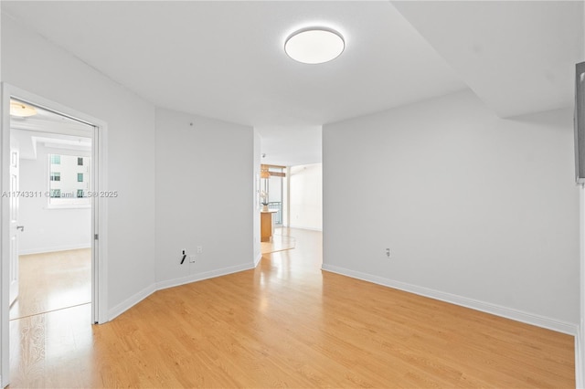 spare room with light wood-type flooring