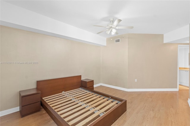 bedroom with light hardwood / wood-style floors and ceiling fan