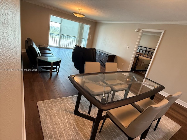 dining room with crown molding and dark hardwood / wood-style flooring