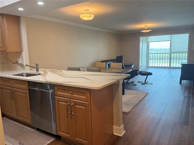 kitchen with sink, dishwasher, light stone counters, ornamental molding, and dark hardwood / wood-style flooring