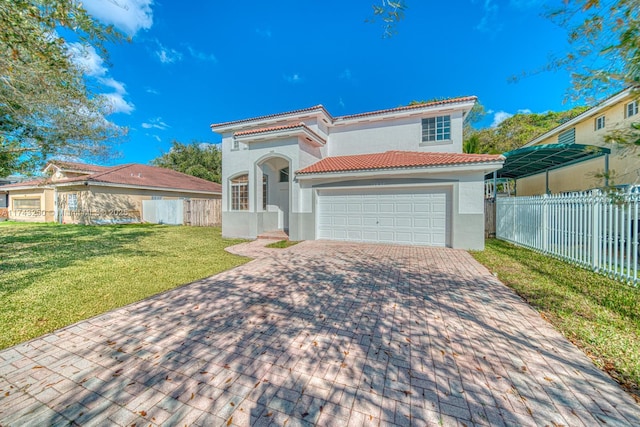 mediterranean / spanish-style home featuring a garage and a front yard