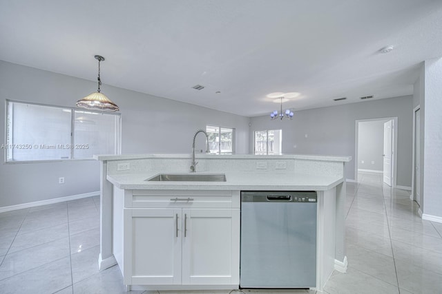 kitchen with sink, dishwasher, white cabinetry, a kitchen island with sink, and light tile patterned flooring