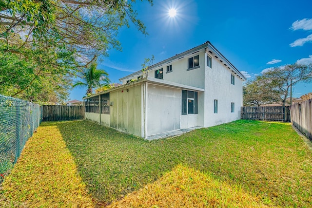 back of house featuring a yard