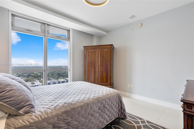 bedroom with light tile patterned floors