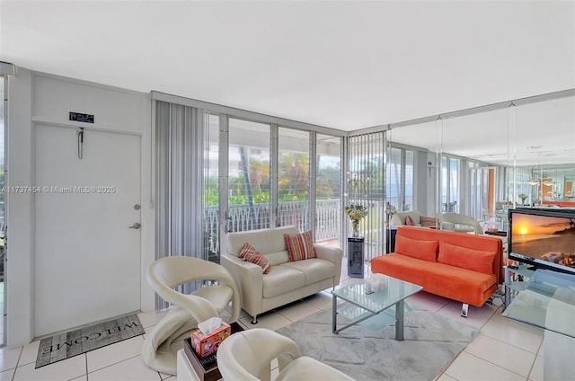 living room with light tile patterned flooring and floor to ceiling windows