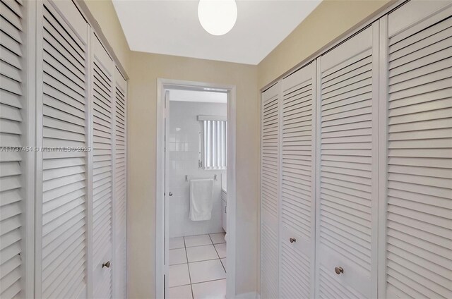 1155 103rd St Unit 9B, Bay Harbor Islands, FL 33154 - hallway featuring tile patterned floors