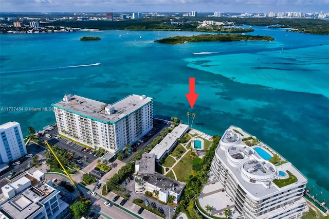 birds eye view of property with a water view