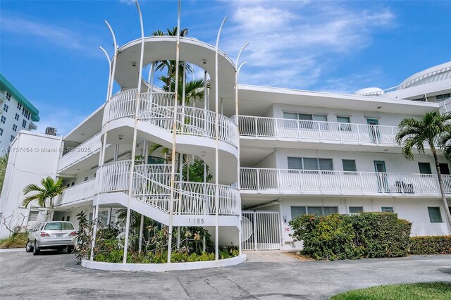 1155 103rd St Unit 9B, Bay Harbor Islands, FL 33154 - view of apartment building / complex with uncovered parking