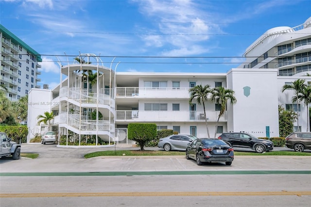 1155 103rd St Unit 9B, Bay Harbor Islands, FL 33154 - view of apartment building / complex with uncovered parking