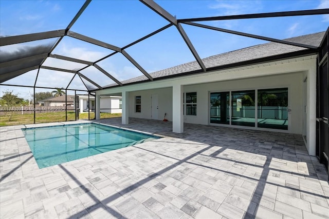 view of pool with a lanai and a patio area