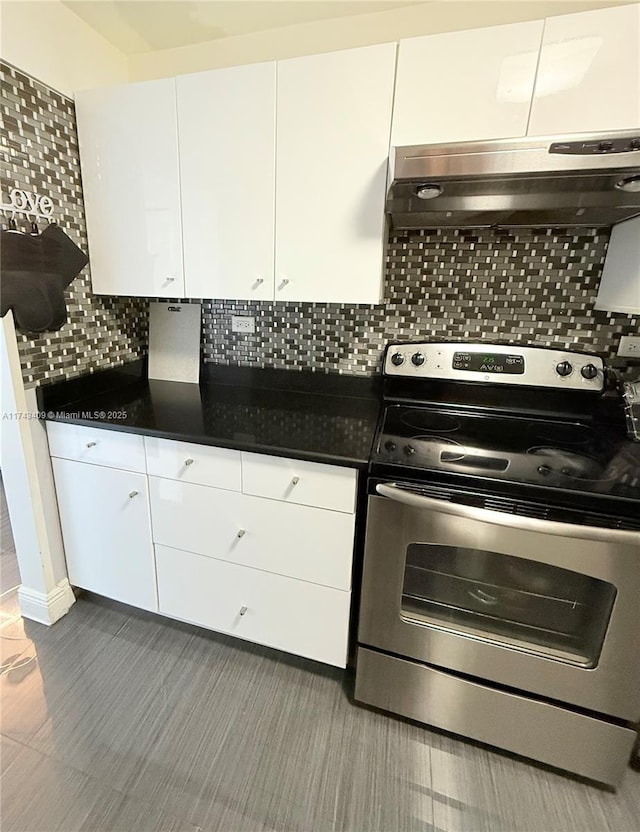 kitchen with white cabinetry, decorative backsplash, and stainless steel electric range oven