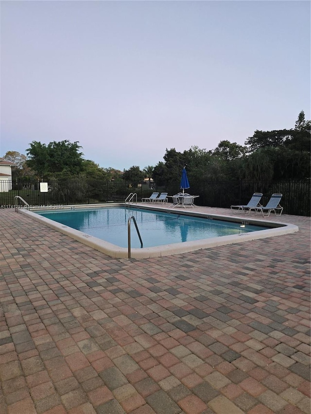 9050 NW 28th St Unit 110, Coral Springs, FL 33065 - community pool featuring a patio area and fence
