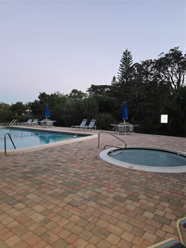 9050 NW 28th St Unit 110, Coral Springs, FL 33065 - community pool with fence and a patio