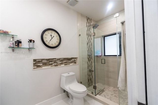 bathroom featuring walk in shower and toilet