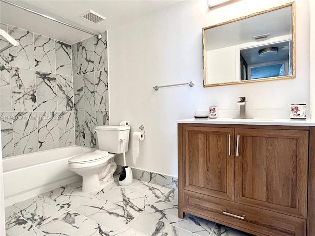 full bathroom featuring tiled shower / bath, vanity, and toilet