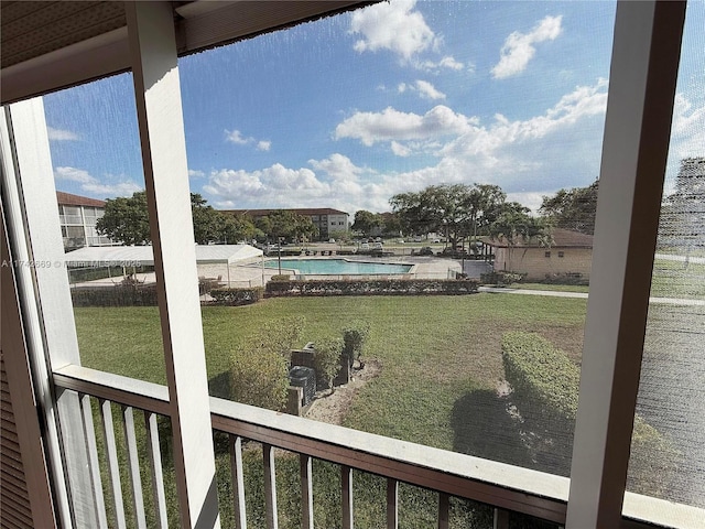 view of yard featuring a community pool