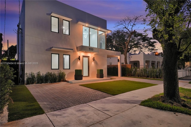 view of front of home with a yard