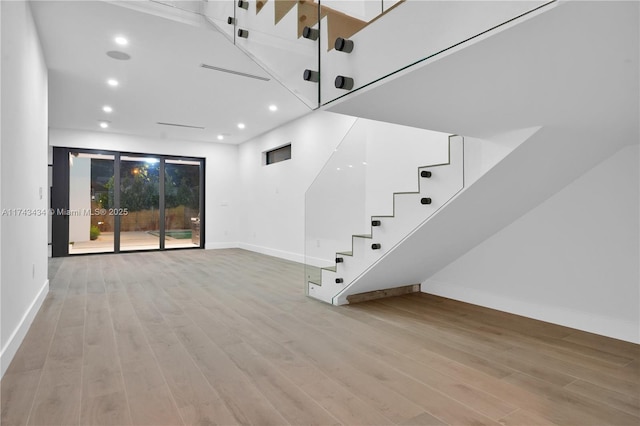 unfurnished living room featuring light wood-type flooring