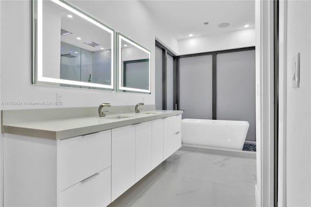 bathroom featuring vanity and a bathtub