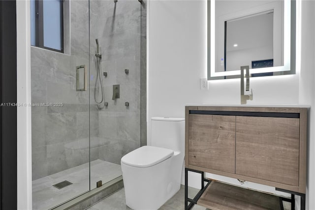 bathroom with vanity, a shower with door, and toilet