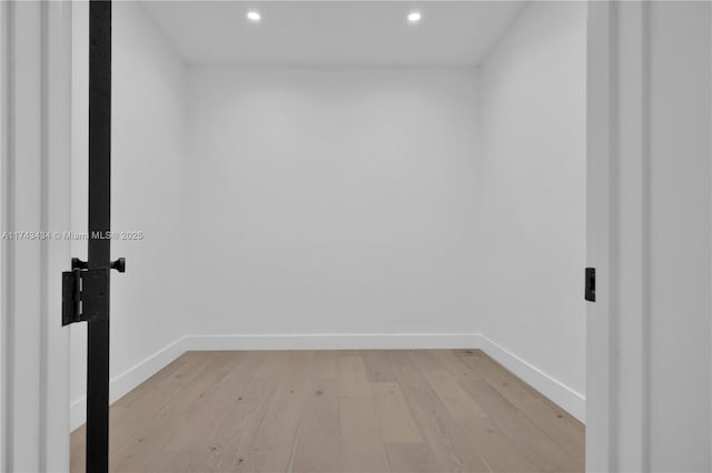 spare room with light hardwood / wood-style flooring