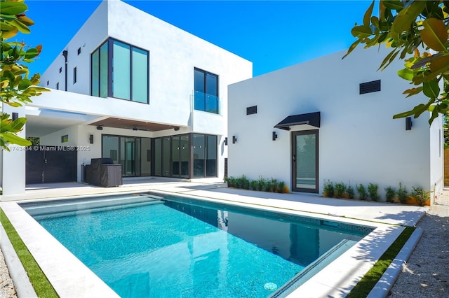 rear view of house featuring a patio area