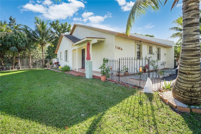 view of front of house with a front lawn