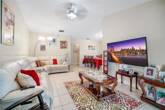 tiled living room with ceiling fan