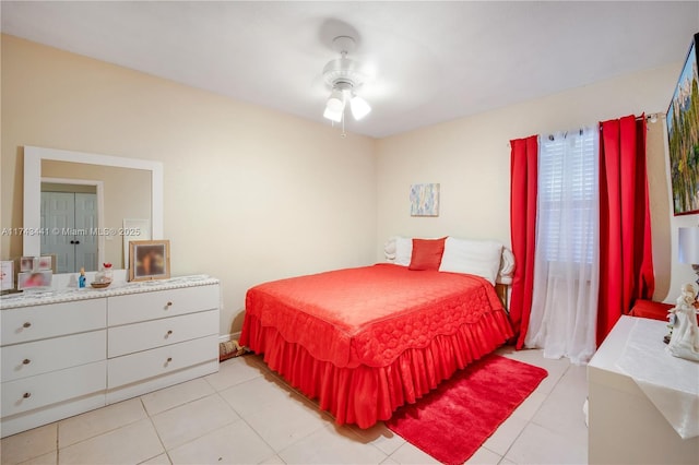 tiled bedroom with ceiling fan