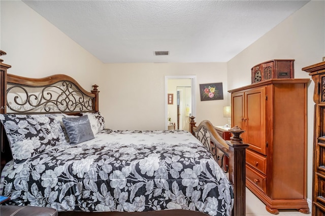 bedroom featuring a textured ceiling