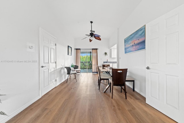 dining room with ceiling fan and light wood-type flooring