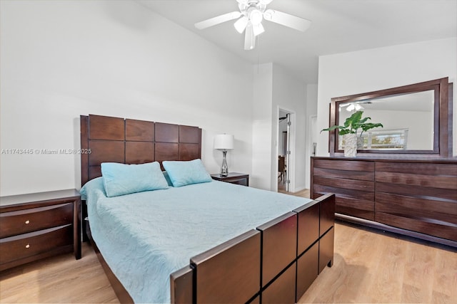 bedroom with light hardwood / wood-style floors and ceiling fan