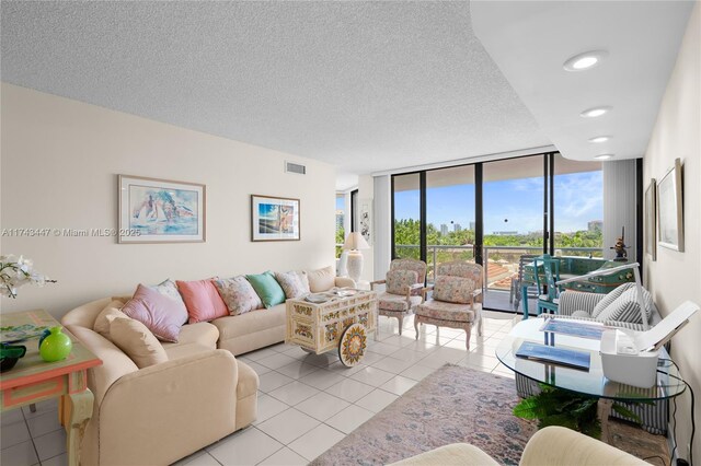 20281 E Country Club Dr Unit 403, Aventura, FL 33180 - living area with a wall of windows, light tile patterned floors, and a textured ceiling