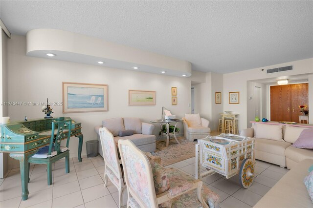 20281 E Country Club Dr Unit 403, Aventura, FL 33180 - living room featuring tile patterned flooring, a textured ceiling, and recessed lighting