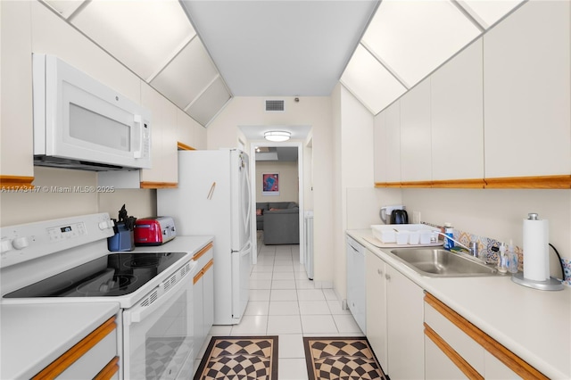 20281 E Country Club Dr Unit 403, Aventura, FL 33180 - kitchen featuring white appliances, a sink, light countertops, and light tile patterned floors