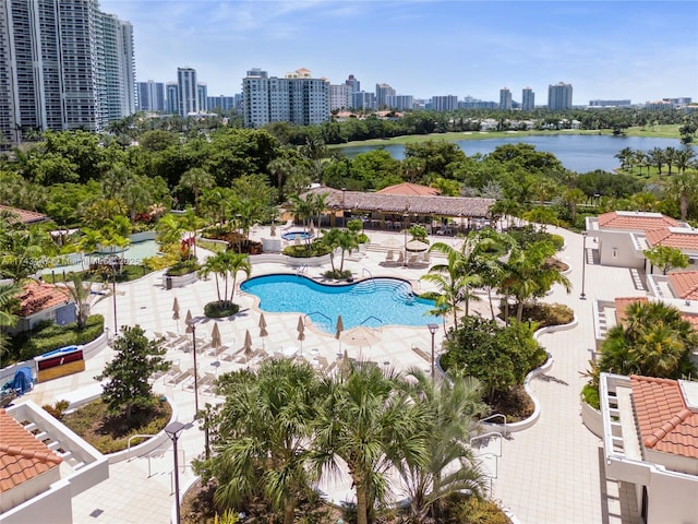 20281 E Country Club Dr Unit 403, Aventura, FL 33180 - drone / aerial view of skyline, a pool area, and a nearby body of water