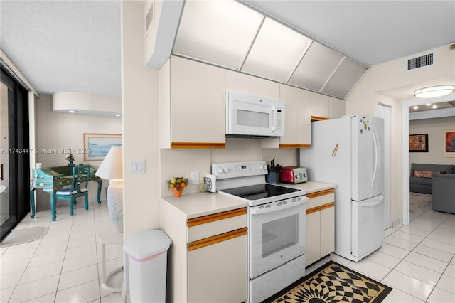 20281 E Country Club Dr Unit 403, Aventura, FL 33180 - kitchen with white appliances, light tile patterned floors, and light countertops