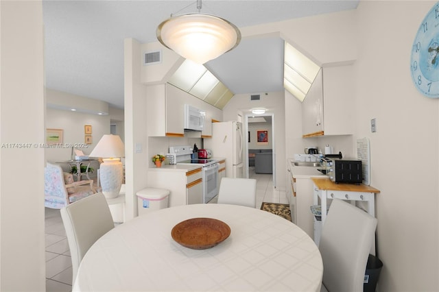 20281 E Country Club Dr Unit 403, Aventura, FL 33180 - dining room featuring light tile patterned floors and lofted ceiling