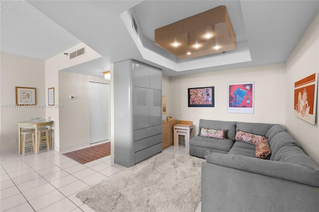 20281 E Country Club Dr Unit 403, Aventura, FL 33180 - living room featuring light tile patterned flooring and a tray ceiling