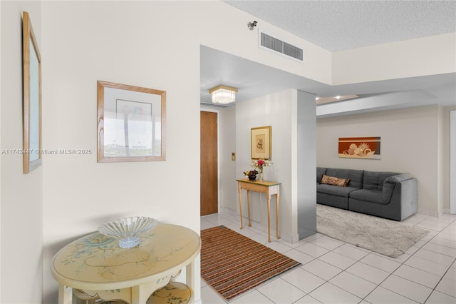 20281 E Country Club Dr Unit 403, Aventura, FL 33180 - corridor featuring light tile patterned floors and a textured ceiling