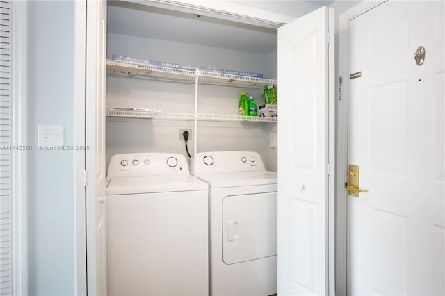 laundry room with washer and dryer