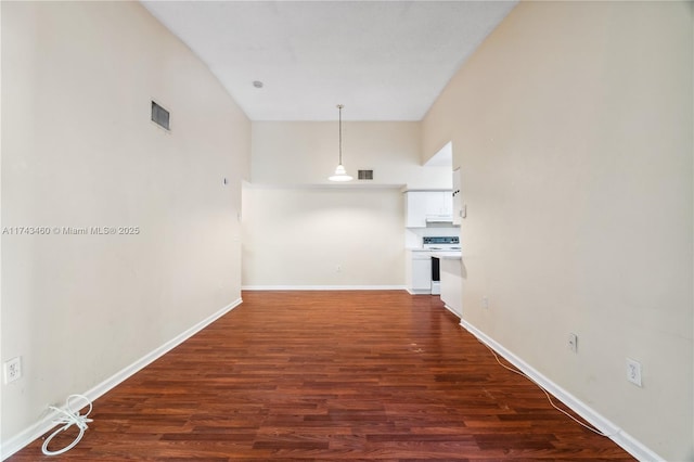 corridor featuring dark wood-type flooring