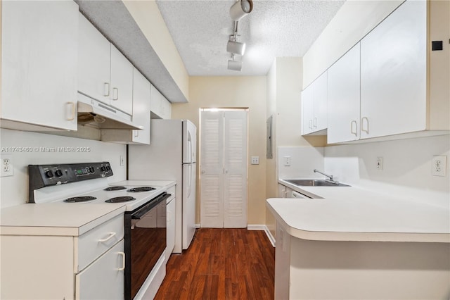 kitchen with electric stove, sink, a textured ceiling, white cabinets, and dark hardwood / wood-style flooring