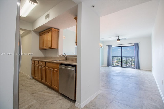 kitchen featuring dishwasher, sink, and ceiling fan